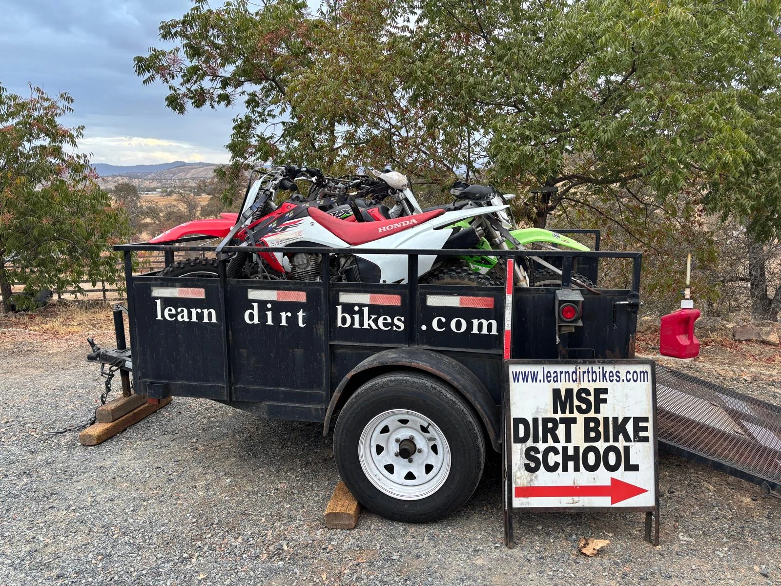 Learn Dirt Bikes trailer loaded with motorcycles at Carnegie